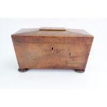 A Regency mahogany tulipwood crossbanded boxwood strung sarcophagus shape tea caddy,