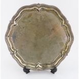 A George III style shaped circular silver salver, Walker & Hall, Sheffield 1930,