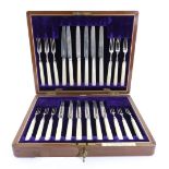 A walnut cased set of twelve pairs of silver fruit knives and forks, Allen & Darwin, Sheffield 1900,