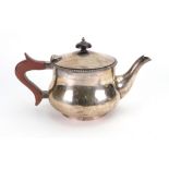 A batchelor Art Deco silver teapot, Lee & Wigfull, Sheffield 1925, baluster shape with gadroon rim,
