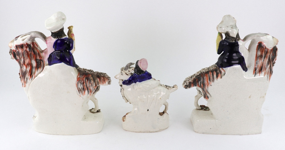 A pair of Staffordshire figures of children kneeling on goats and holding birds, - Image 3 of 5