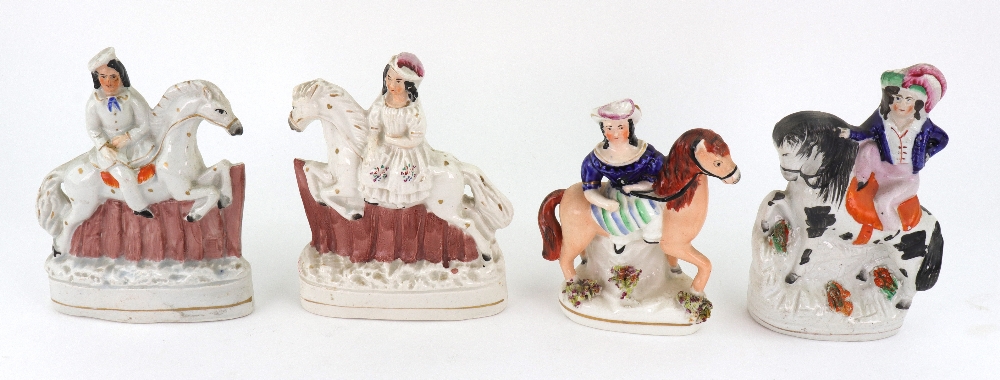 A pair of Staffordshire pottery figures of a boy and girl on horseback jumping fences, 16cm high, - Image 4 of 5