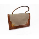 A vintage Hermes tan leather and fabric 'Piano' handbag, circa 1960s/70s, with fitted interior,