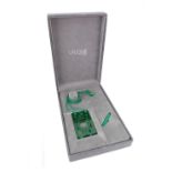 Lalique: a green glass rectangular pendant, formed from the letters of 'LALIQUE' on a green cord,