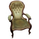 A Victorian foliate carved walnut frame button down upholstered armchair, circa 1860,