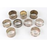 Nine silver napkin rings, including two Victorian examples, one London 1876,