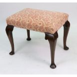 A mid 18th century walnut dressing stool, with upholstered rectangular seat,