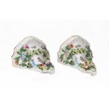 A pair of Dresden porcelain wall brackets, of shaped outline,