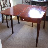A George III mahogany fold over top tea table, with rounded corners, boxwood banded,