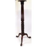 An early Victorian mahogany four poster bed column, later adapted as a torchere, reeded,