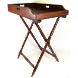 A butler's Victorian mahogany tray, circa 1840, with cut-out handles on three sides,