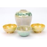 A Ruskin pottery miniature bowl, with a yellow and green crystalline glaze pooling to the centre,