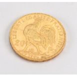 A French gold 20 Francs coin, 1906.