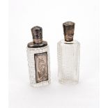 Two Dutch silver mounted cut glass perfume bottles, 19th century, of oval section,