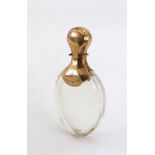 A Dutch gold mounted glass perfume bottle, 19th century, of oval facet cut form,
