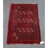 A Turkoman Juval, early 20th century, the madder field with three rows of four guls,