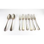 A set of four Edwardian silver Hanoverian pattern 3-prong table forks,