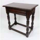 An oak side table, reconstructed, elements 17th century, with two end drawers,