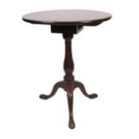 A George III mahogany pedestal table, the circular revolving tilt-top,