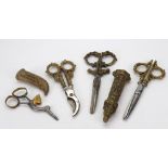 A pair of decorative brass handled steel scissors and sheath, second half 19th century,