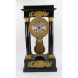 Robert A Paris: A Napoleon III ebonised gilt metal mounted Portico clock,