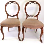 A set of six Victorian carved mahogany balloon back dining chairs, circa 1860,