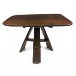 An oak tilt-top table, 17th/18th century, the rectangular top with canted corners,