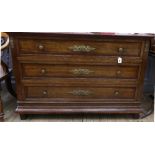 An Empire style mahogany gilt metal mounted commode, circa 1900, with three long drawers,