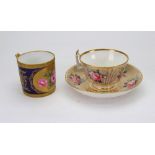 A Stevenson & Hancock Derby porcelain coffee can, painted with roses in an oval gilt cartouche,