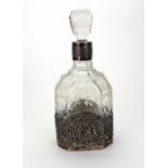 A silver mounted glass decanter, English Import marks for London 1928, of octagonal form,