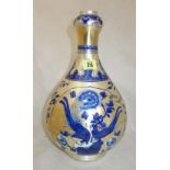 A Chinese 'clobbered' blue and white onion vase, 19th century, of pear form with onion neck,