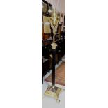 A Victorian style brass and ebonised adjustable standard lamp , of Corinthian column form,