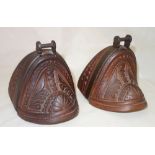 A pair of hardwood and steel bound enclosed stirrups, early 20th century, possibly South American,