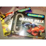 A Scalextric Grand Prix racing set, a Scalextric 'Crash & Bash' set and two accessory sets (4).