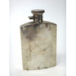 A silver spirit flask of curved rectangular plain form, with a milled edged circular top,