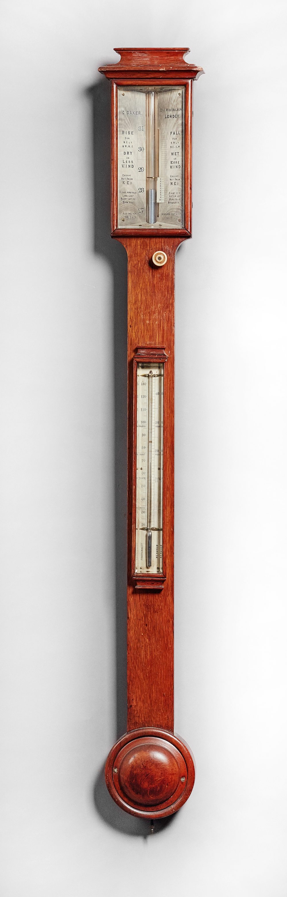 A late Victorian oak stick barometer By C.