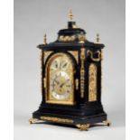 A giltmetal-mounted ebonised three train mantel clock, of large size Retailed by Wilson, Penrith,