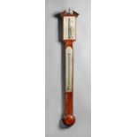 A George III mahogany stick barometer By Baptiste Roncheti & Co With a broken arched pediment