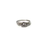 A diamond five stone ring, the principle round brilliant cut diamond weighting approximately 0.