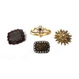 A gold and seed pearl set brooch, designed as a starburst, a shaped rectangular mourning brooch,
