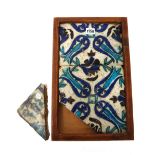 A Damascus pottery tile panel, 16th/17th century, comprising of two tiles, painted in blue ,