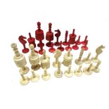 A German 'Barleycorn' pattern stained bone chess set, late 19th century, of turned form (a.