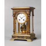A French gilt brass four-glass mantel clock In the Empire Revival style, circa 1900, Maple & Co.