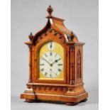 A late Victorian walnut Gothic Revival three train mantel clock By Dent, London, No.