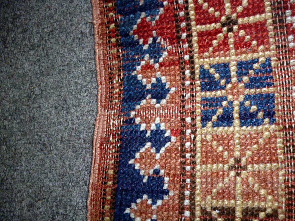 A Karachor Kazak rug, Caucasian, the indigo field with two ivory squares, a madder central cross, - Image 9 of 11