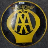 A double sided 'AA' enamel advertising sign of circular form, black and yellow, 'Franco SW1',