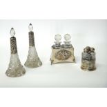 A pair of faceted glass scent bottles, with stoppers,