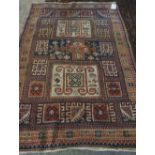 A Karachor Kazak rug, Caucasian, the indigo field with two ivory squares, a madder central cross,