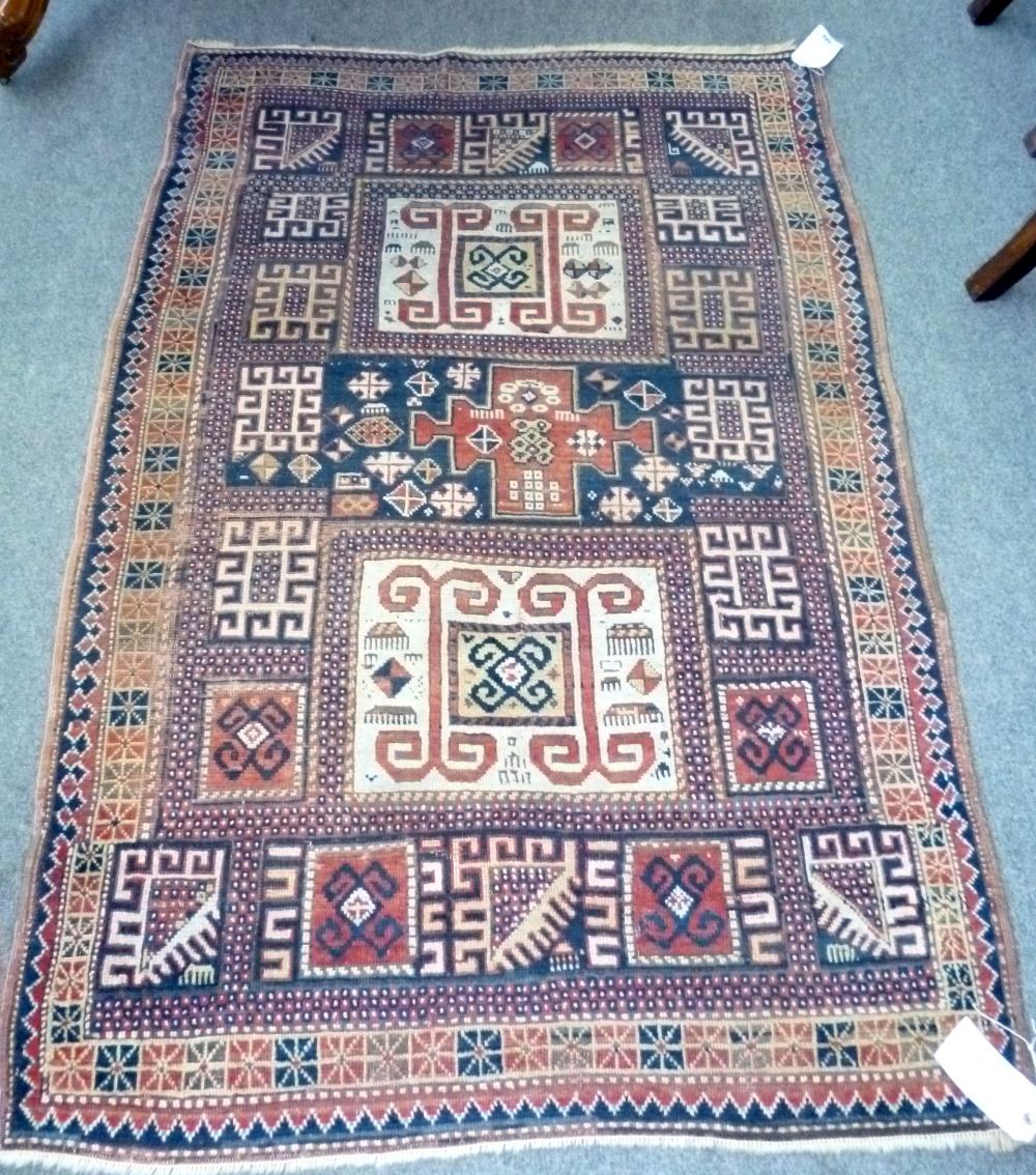 A Karachor Kazak rug, Caucasian, the indigo field with two ivory squares, a madder central cross, - Image 11 of 11