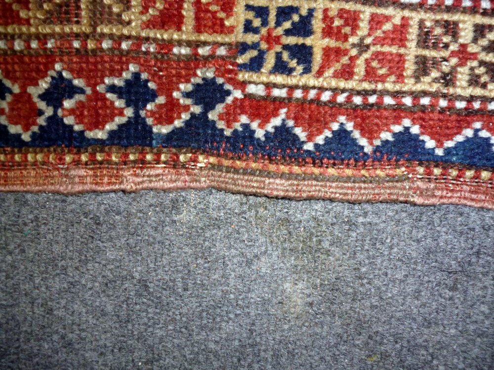 A Karachor Kazak rug, Caucasian, the indigo field with two ivory squares, a madder central cross, - Image 8 of 11